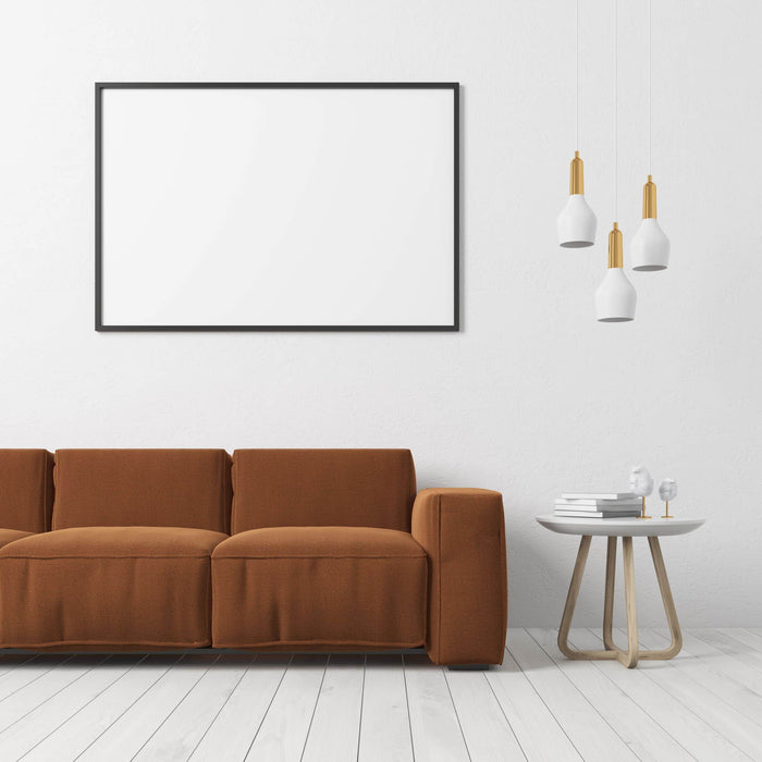brown sofa on white wooden flooring