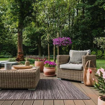 large outdoor rug on a garden patio