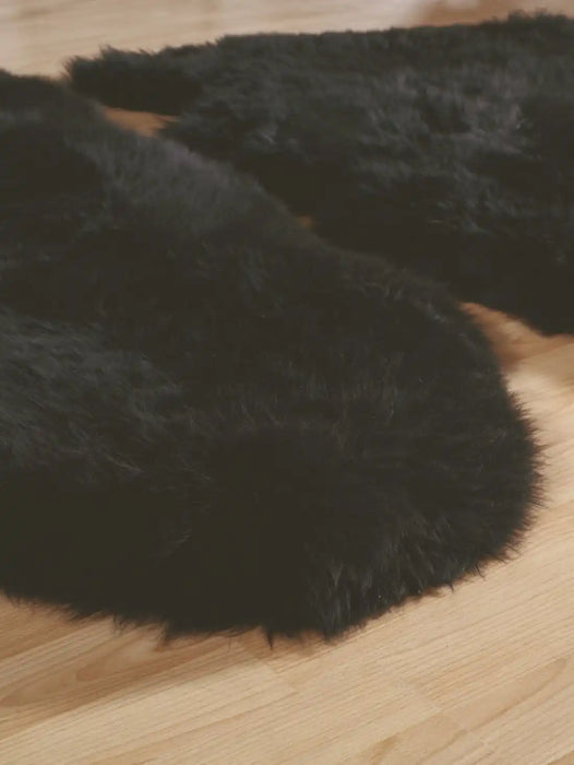 Origins sheepskins hug black Black Living Room Wool Rug.